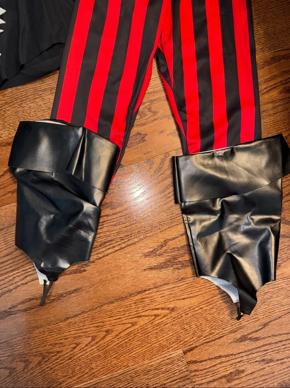 Size M/8-10 pirate costume. Shirt, Pants, Belt, Boot Covers, Scarf, wrist cuffs.